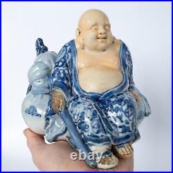 Antique Japanese Blue and White Porcelain Figurine of Seated Hotei Early 20th c